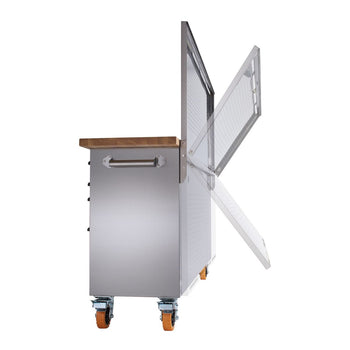 A stainless steel rolling workbench with a light brown wooden top and orange wheels is shown against a white background. The workbench features a handle on the left side and a pegboard attached to the back, with its door shown in multiple stages of opening.