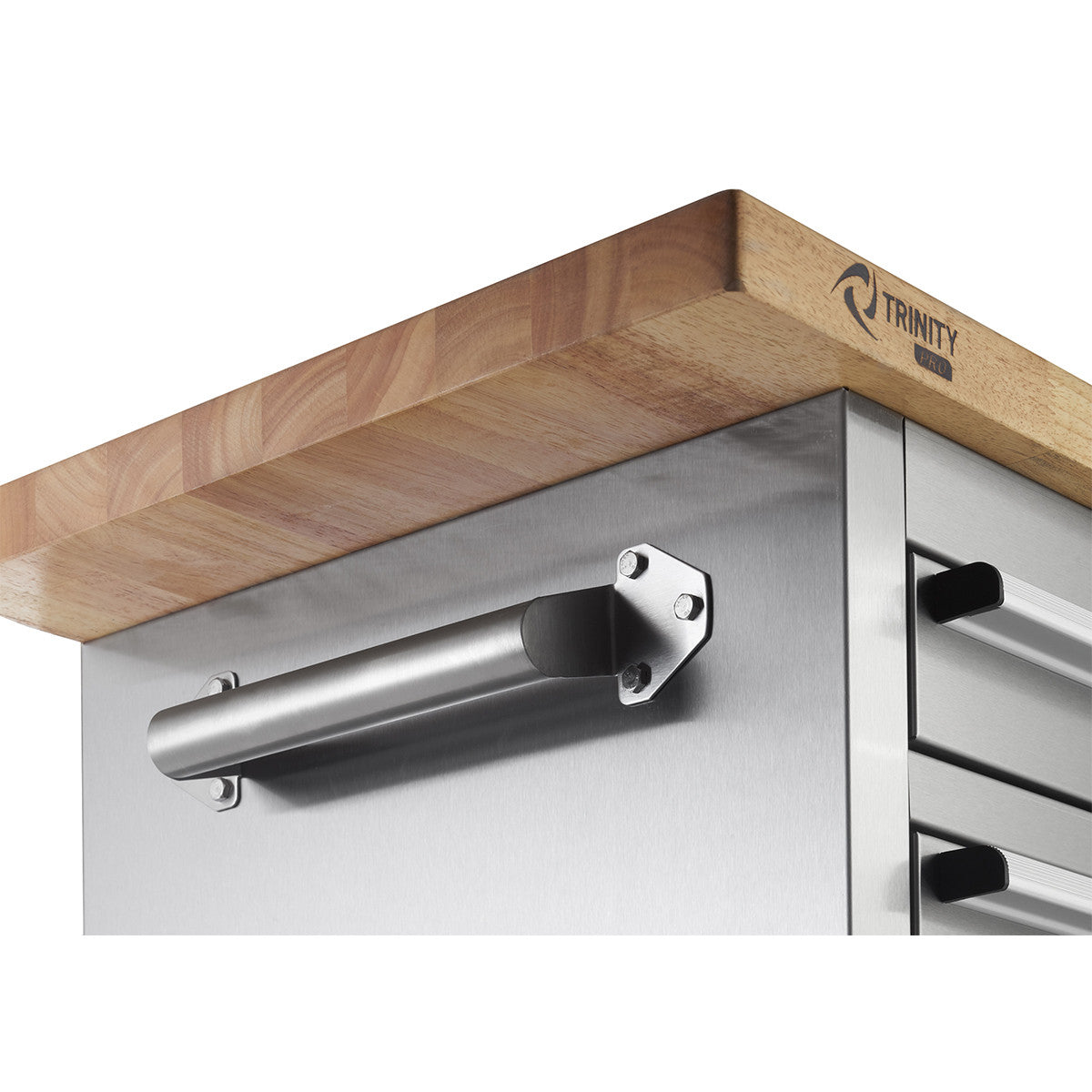 A close-up shows the corner of a Trinity PRO stainless steel rolling workbench. The workbench features a light-colored wooden butcher block top and a stainless steel side with a cylindrical handle attached horizontally.