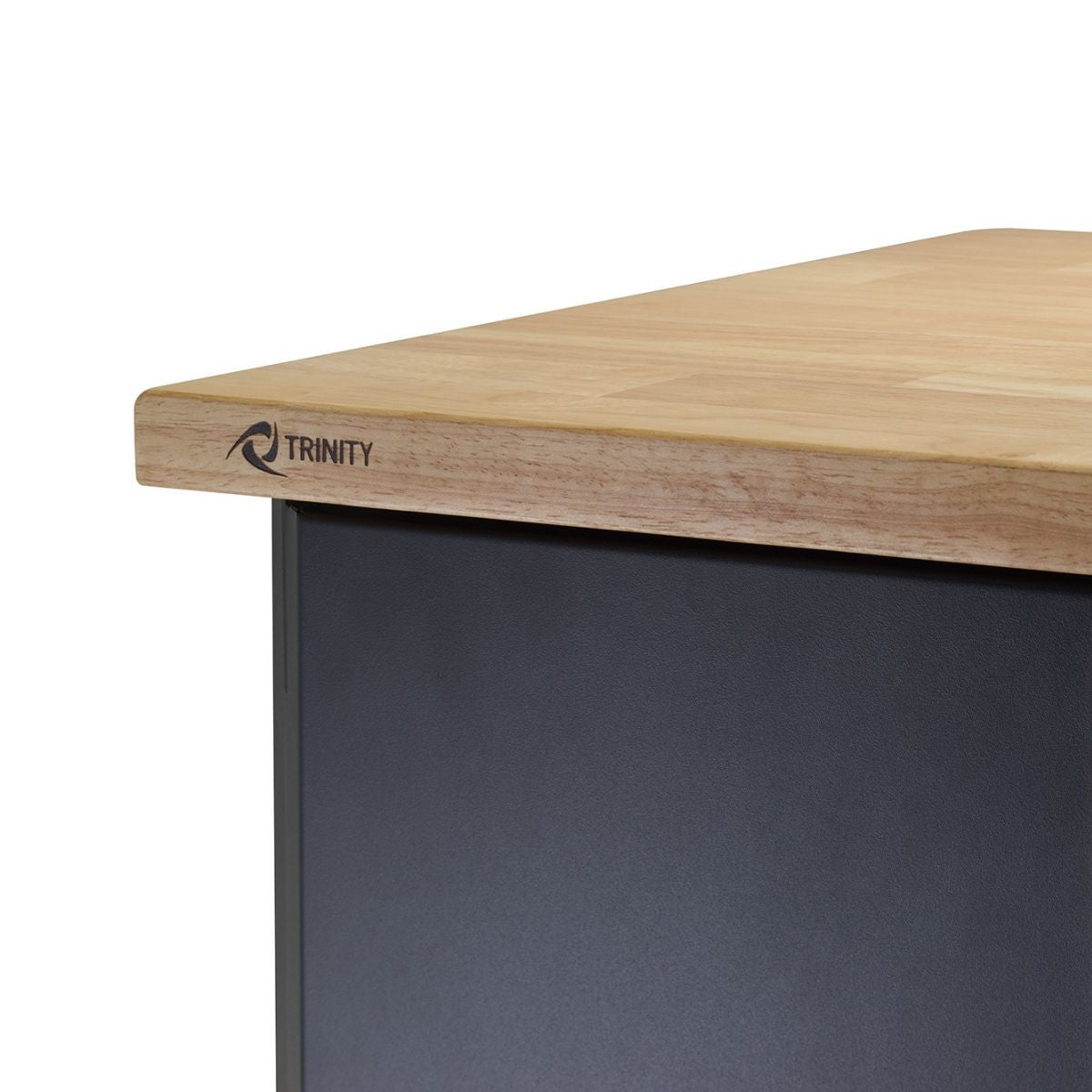 Close up of a one inch thick solid wood top with trinity mark on the front left side.