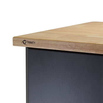 Close up of a one inch thick solid wood top with trinity mark on the front left side.