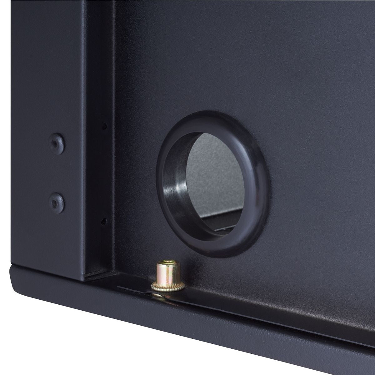 A two inch diameter cable hole opening located at the back side of a black cabinet.