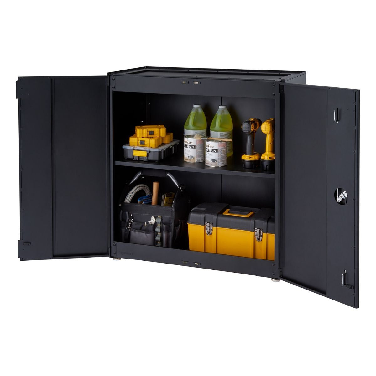 A black, two-door modular garage cabinet is shown with its doors open, revealing two shelves containing various tools and supplies. The cabinet holds items such as toolboxes, paint cans, bottles, and power tools, suggesting organized storage for a garage or workshop.