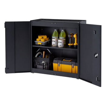 A black, two-door modular garage cabinet is shown with its doors open, revealing two shelves containing various tools and supplies. The cabinet holds items such as toolboxes, paint cans, bottles, and power tools, suggesting organized storage for a garage or workshop.