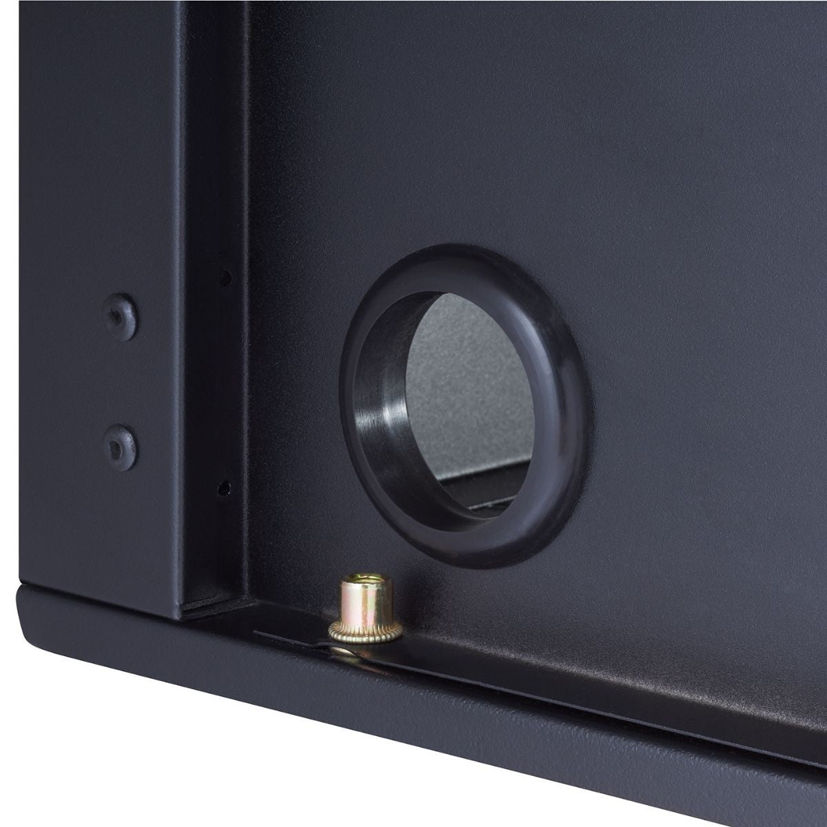 Close up of a two inch diameter cable hole opening located at the back side of the black cabinet.