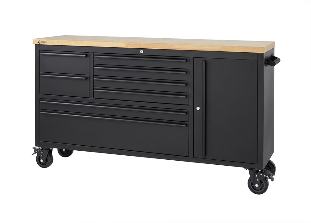 A matte black mobile tool workbench featuring a solid wood top and heavy-duty locking casters is shown against a plain white studio background. All of its drawers and side cabinets are completely closed, displaying a clean, empty workstation setup.