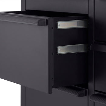 A close-up view highlights a sturdy, matte black handle bolted to the side of a black tool cabinet. Just above the handle, the edge of a thick wooden workbench top features the branded "TRINITY PRO" logo.