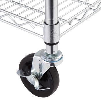 A close-up shot of a metal caster wheel attached to a wire shelving unit. The wheel is black, with a silver metal frame and a lever that reads 