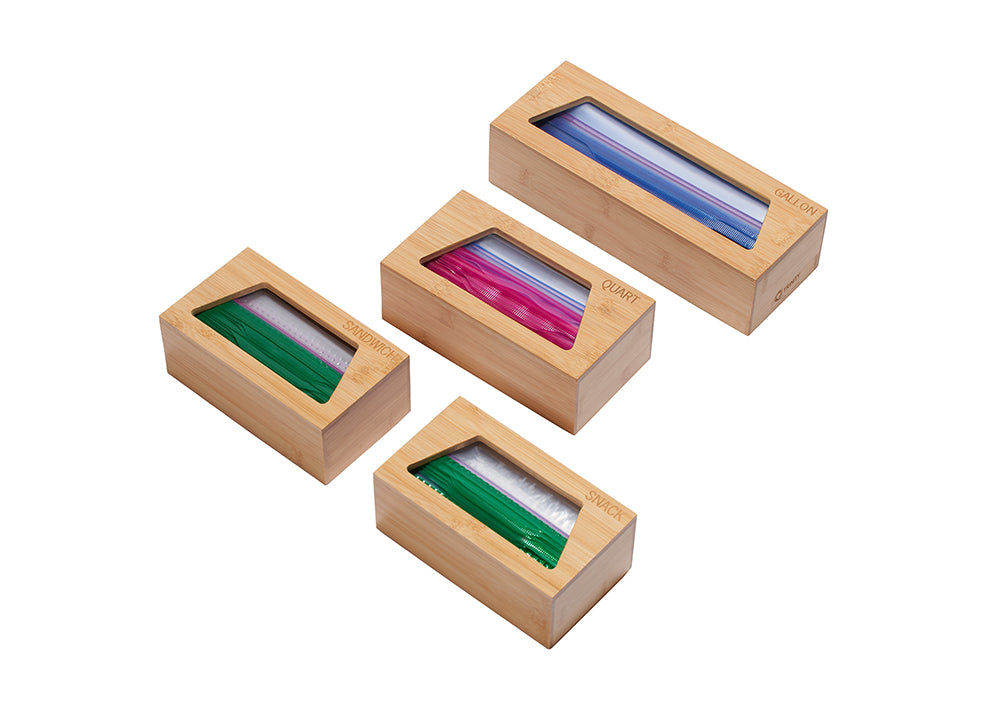 A set of four bamboo storage boxes, each designed to hold different sizes of plastic bags. The boxes are labeled "GALLON," "QUART," "SANDWICH," and "SNACK," and clear windows on top allow visibility of the colorful bags inside.