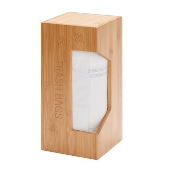 A tall, rectangular bamboo dispenser is shown with a roll of white trash bags visible through a cutout on the front. The words 