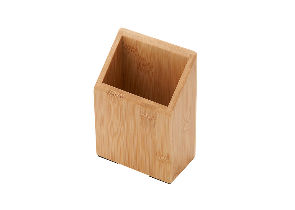 A wooden desk organizer made of light-colored bamboo. The rectangular container has a slanted top opening and is shown from a high-angle view on a white background.