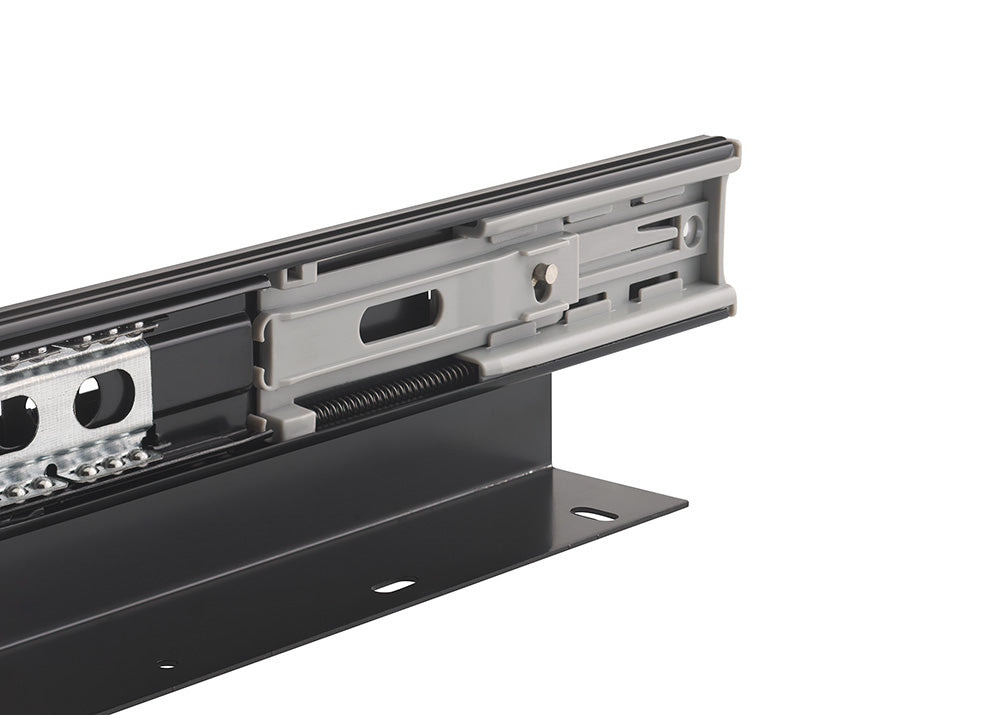 A close-up shot details the intricate mechanical components of a black metal drawer slide. The assembly highlights steel ball bearings, a grey plastic soft-close mechanism, and an L-shaped mounting bracket with pre-drilled holes.