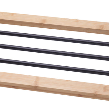 A close-up of a shoe rack made from light-colored bamboo wood and three black metal bars. The wood has a noticeable grain and the metal bars are evenly spaced.