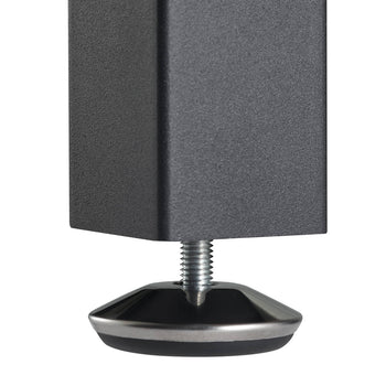 A close-up shows the adjustable leveling foot of a dark gray, square furniture leg. The foot features a silver, conical cap with a black, circular base and a threaded silver stem extending upwards into the leg.
