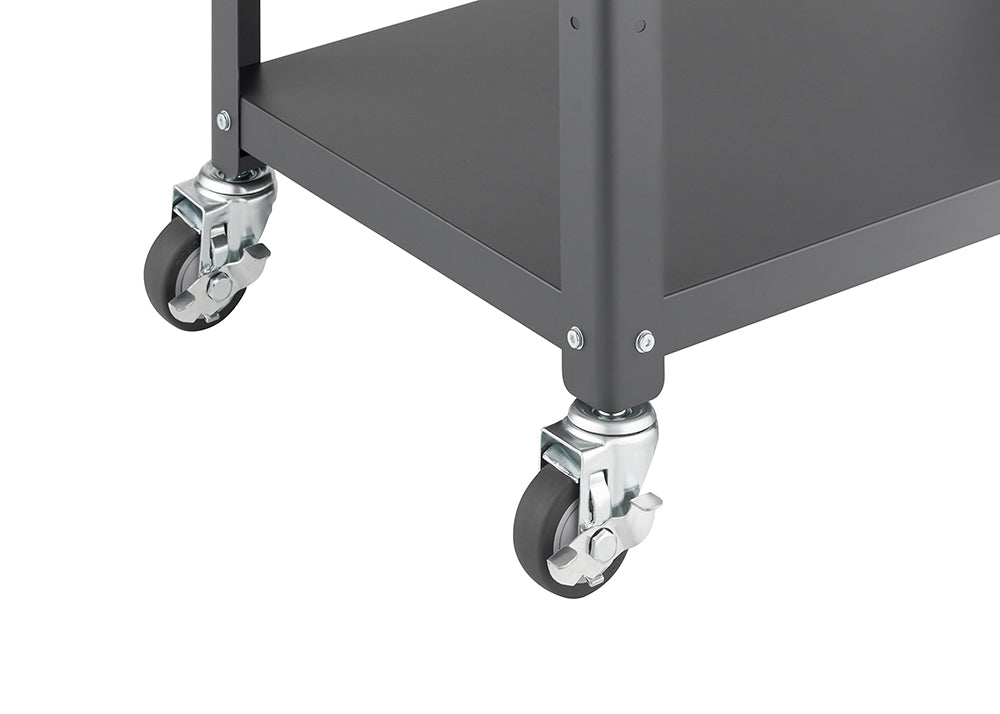 Close-up of the bottom corner of a dark gray metal utility cart, showing two of its four rubber swivel casters. The casters are silver, feature a locking mechanism, and are attached to the cart's square metal legs with screws.