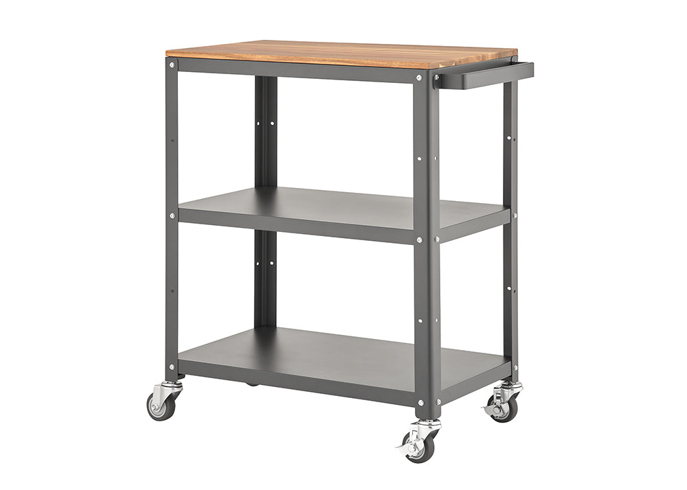 A functional, three-tier utility cart with a dark grey metal frame and a light brown, wooden top surface. The cart is on four swivel caster wheels, featuring two lower open metal shelves and a handle on the right side for easy mobility.