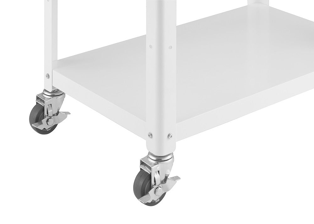 A close-up shot of the white metal frame and wheels of a kitchen cart. The cart has two shelves, and the wheels are gray with locking mechanisms.