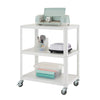 A white metal utility cart with three shelves is shown against a white background.  The cart is holding a light blue Cricut machine, craft supplies, and rolls of colored paper.