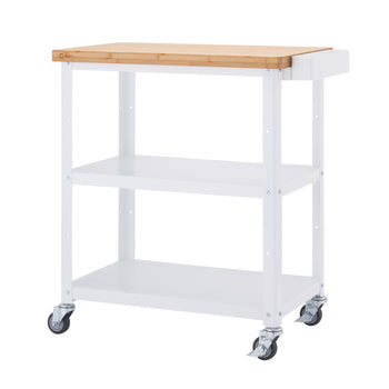 A white kitchen cart with a light brown wooden top stands on four wheels. The cart has two white shelves below the wooden top, and a small, narrow extension on the right side of the wooden top.