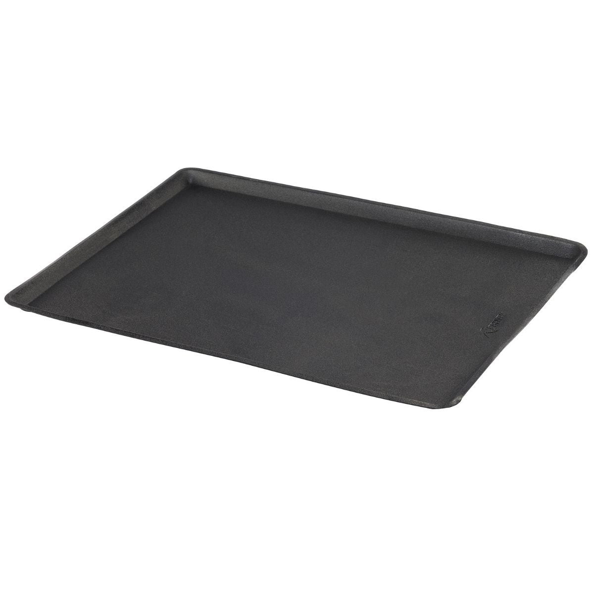 A rectangular, black non-stick baking sheet with slightly raised edges is shown against a white background. The pan is angled slightly, revealing a small logo in the bottom right corner.