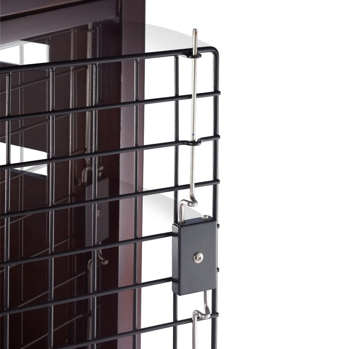 A close-up shows a black wire pet crate with a small black padlock securing the door. The padlock is attached to thin metal rods that slide into the crate's frame.