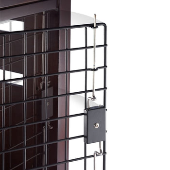 A close-up shows a black wire pet crate with a small black padlock securing the door. The padlock is attached to thin metal rods that slide into the crate's frame.