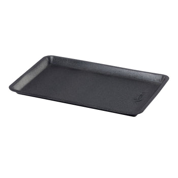 A slightly angled, eye-level shot shows an empty, rectangular black foam food tray with a subtle textured surface. The tray has a raised rim and rounded corners, suggesting it's designed for holding and presenting food items.