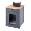 A dark gray wooden end table with a cat litter box enclosure is shown against a white background. The table features a light wood top, a drawer, and a door with a clear panel, revealing a litter box inside.