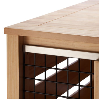 A close-up shot shows the corner of a light brown wooden pet crate accent table. The table features a black metal wire mesh on the side.