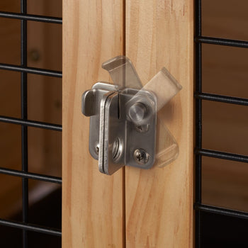 A close-up of a silver iplusmile Front Door Lock for Kids mounted on a wooden door. The lock is shown in the open position, with a blurred image indicating its movement.