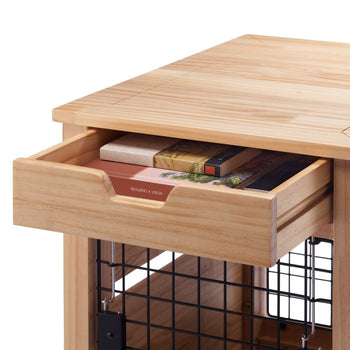 A close-up shot shows a light-colored wooden nightstand with a partially open drawer revealing several books inside. Below the drawer, a black wire mesh shelf is visible.