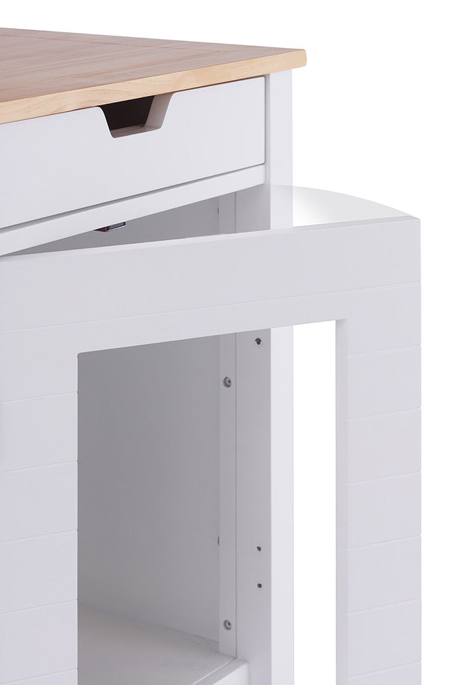 A close-up shot of a white kitchen island corner with a light wood countertop, featuring a partially open white door with a clear acrylic panel. The door reveals a shelf inside the island.