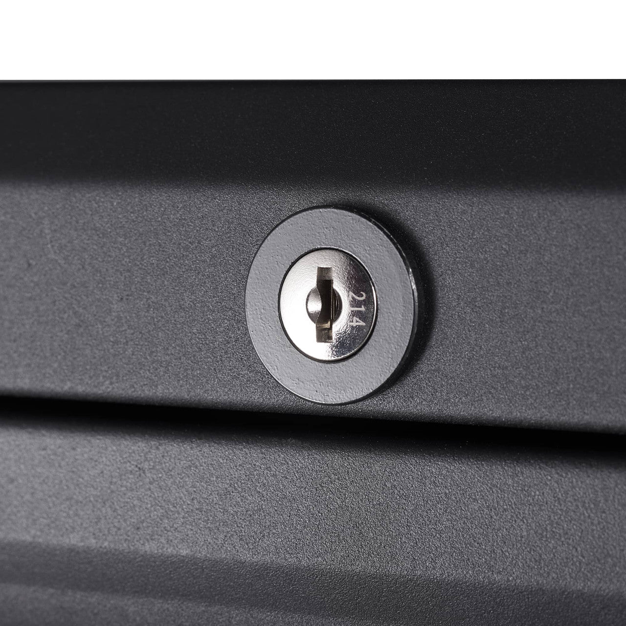 A close-up shot shows a silver cylinder lock embedded in a dark gray or black surface. The lock has a keyhole with a horizontal slot and the number "214" faintly etched on its right side.