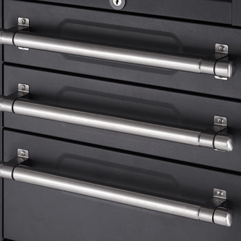 A close-up shot shows three horizontal, brushed metal handles on a dark gray or black storage cabinet. The handles are cylindrical with rounded ends and are mounted on square backplates with visible screws.