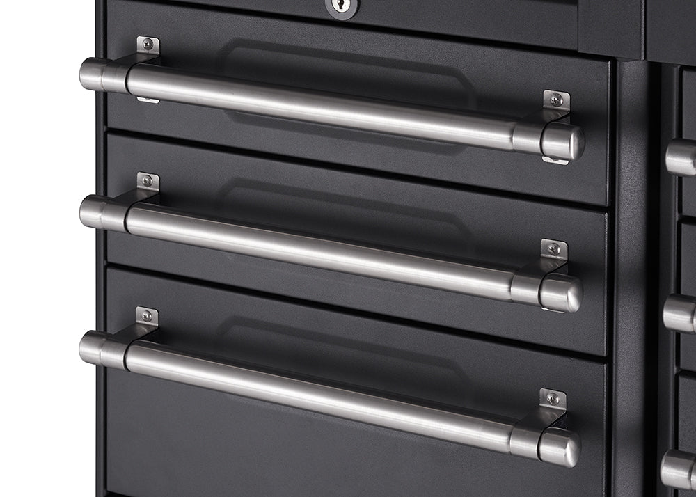 A close-up shot shows three horizontal, brushed metal handles on a dark gray or black storage cabinet. The handles are cylindrical with rounded ends and are mounted on square backplates with visible screws.