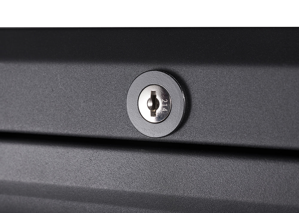 A close-up shot shows a round, silver-colored lock on a dark, textured surface. The lock has a keyhole in the center with the number "214" faintly visible on its surface.