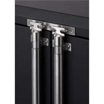 Close-up view of the stainless steel handles and hinges of a black cabinet door. The handles are cylindrical and vertically oriented, attached to the door with small, square mounting plates.