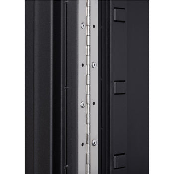 A close-up of the hinge and side of a black Trinity PRO 8-Piece Garage Cabinet set. The focus is on the silver hinge attached to the cabinet's door.