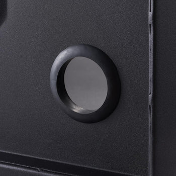 A close-up shows a circular glass viewport with a thick black rubber gasket set into a textured black metal surface. The viewport offers a glimpse into a darker interior space.