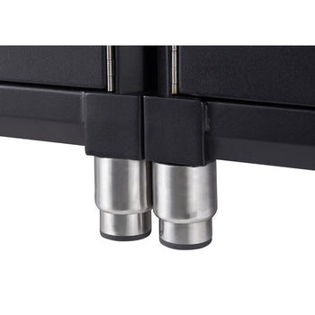 Close-up view of the bottom of a black cabinet, showing two cylindrical, stainless steel legs. Each leg has a black, circular foot at the bottom and is attached to the cabinet's frame.