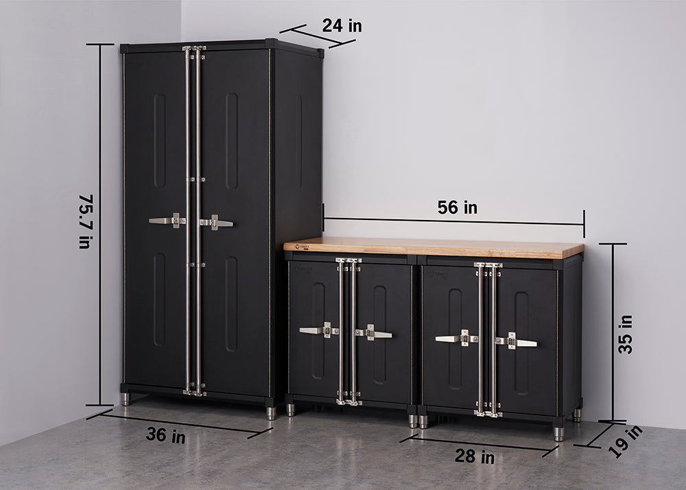 A two pieces of black metal garage storage cabinetry against a white wall. The taller piece is a 75.7-inch tall locker cabinet that is 36 inches wide and 24 inches deep, and the shorter piece is a 35-inch tall workbench/cabinet that is 56 inches wide and 28 inches deep with a wooden countertop.