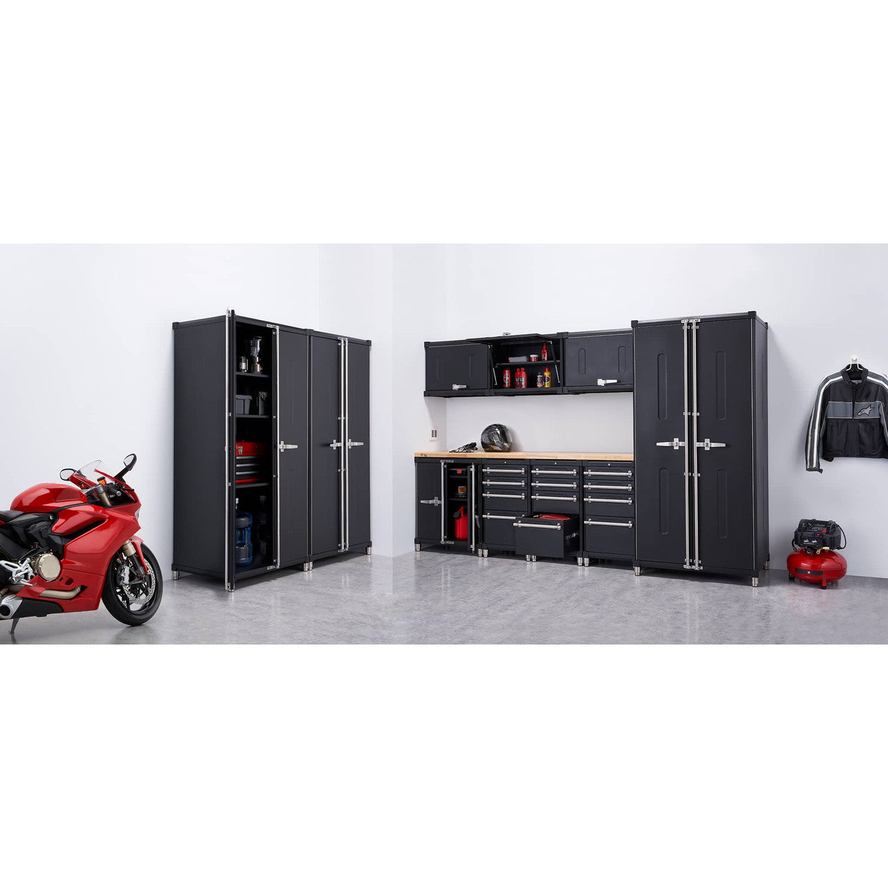 Trinity Pro 11 piece garage cabinet set with 3 locking cabinets, 1 base cabinet, 3 base cabinets with drawer, 3 wall cabinets, and an 84 inch wide solid wood top. A red motorcycle and an air compressor add a touch of functionality and style to the clean, polished concrete floor.