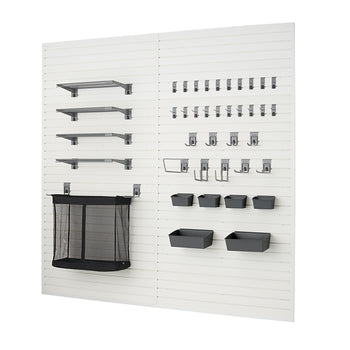 A modular garage organization system is shown, featuring white slatwall panels with various dark gray accessories. On the left are four shelves of different lengths and a large mesh storage bin, while the right side displays multiple rows of hooks and several small bins.