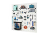 A well-organized white slatwall system displays various tools and household items in a garage or workshop. Shelves, hooks, and bins hold everything from power drills and hammers to an umbrella and an extension cord, demonstrating efficient storage.