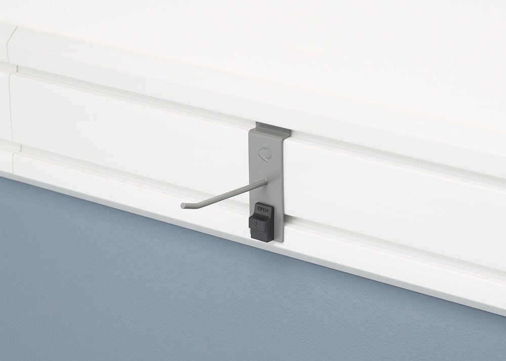 A single gray hook is attached to a white slatwall. The hook has a black locking mechanism at its base, which is labeled "OPEN."