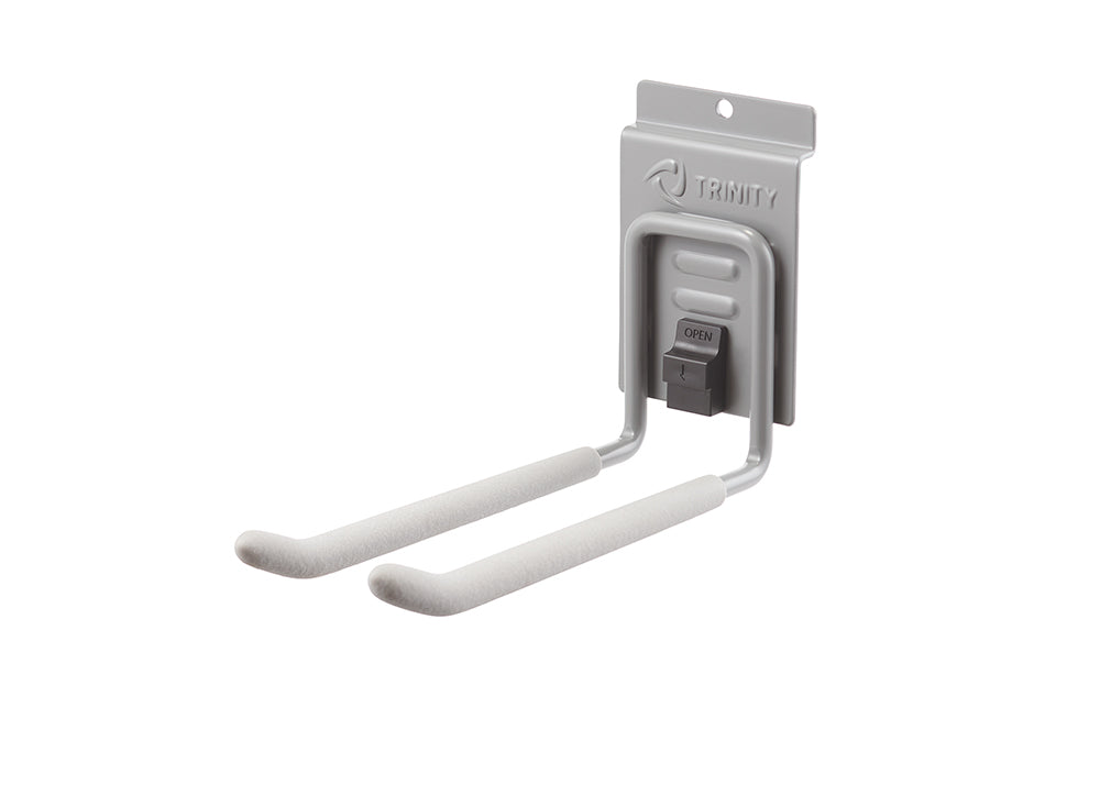 A close-up of a Trinity brand gray utility hook with two long, foam-padded prongs. The hook has a spring-loaded mechanism that says "OPEN" on a black latch.