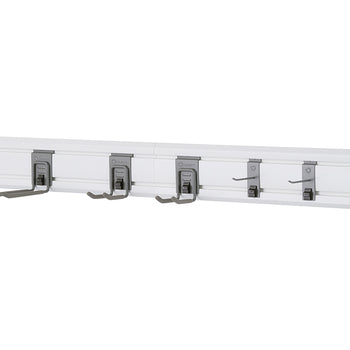 A close-up, eye-level shot shows a white wall-mounted storage track with five gray utility hooks. The hooks are spaced out evenly and are holding nothing.