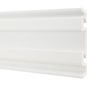 A horizontal, white plastic molding strip with a complex, tiered profile. The profile features multiple parallel ridges and grooves, with a wide, flat top section and a narrower, grooved bottom section.