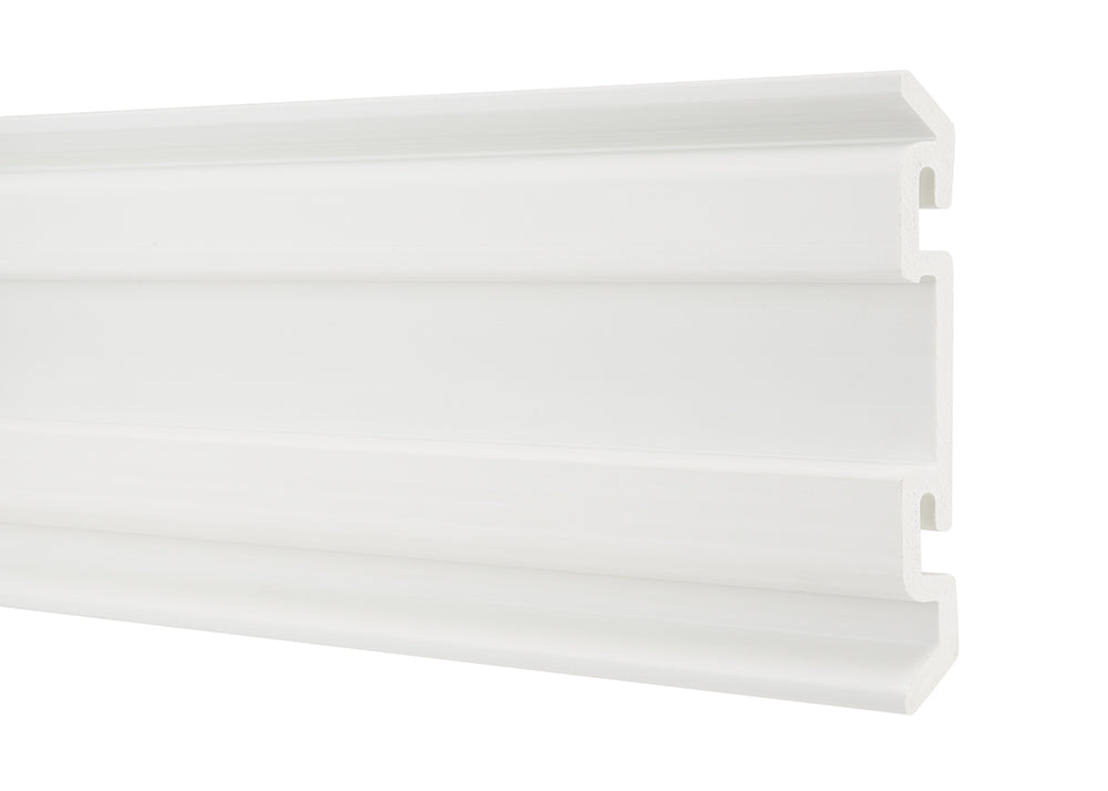 A long, horizontal piece of white plastic or PVC trim is shown from a slight angle. The trim has a decorative, multi-layered profile with several horizontal grooves and a stepped-back design on the top and bottom edges.