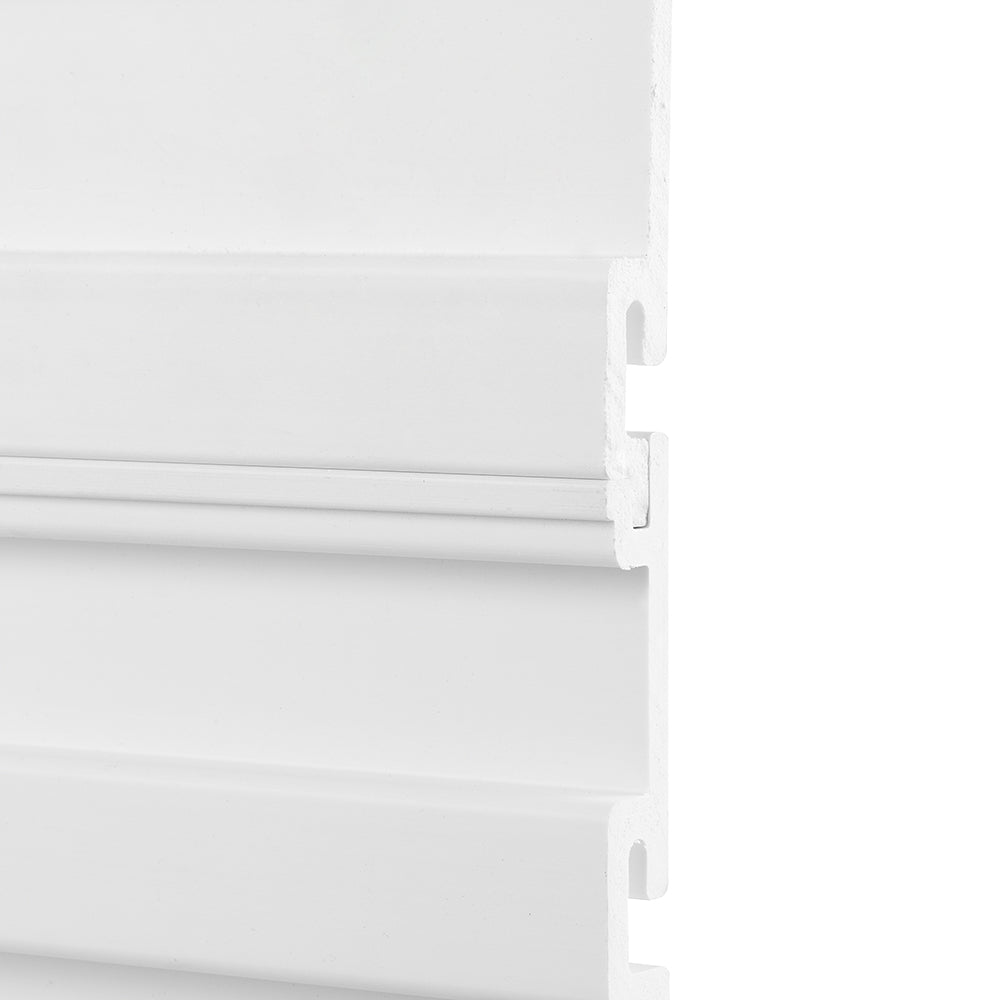 A close-up image of a white interlocking wall panel with a grooved design. The panel appears to be made of PVC or a similar material, showcasing its tongue-and-groove connection system.