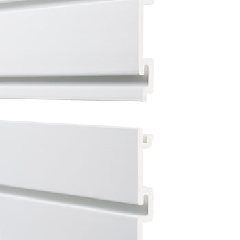 A close-up image of two white interlocking wall panels with a tongue-and-groove design, showing their connection mechanism. The panels have a smooth finish and are slightly separated to highlight their interlocking edges.